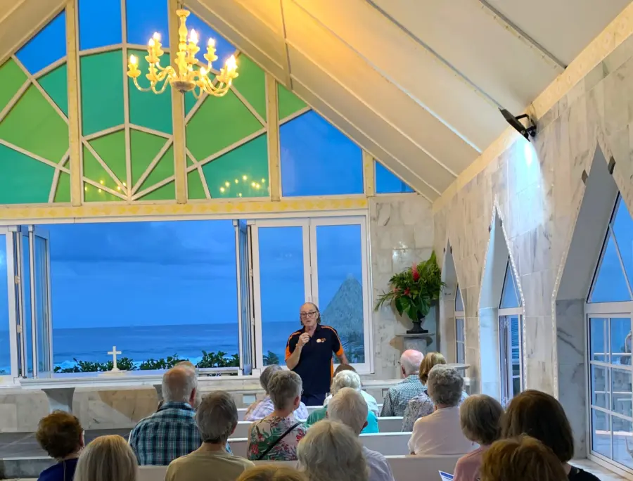 Speaker addresses audience in ocean-view chapel
