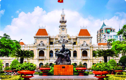 Statue before Saigon City Hall with Vietnamese flag