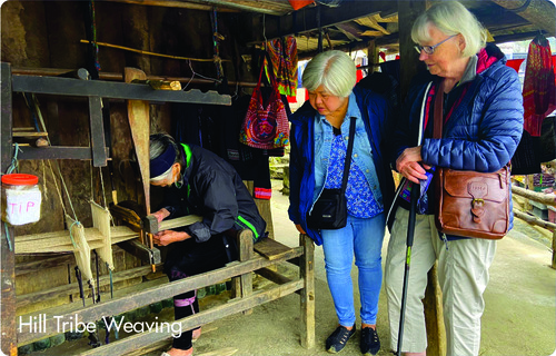 Visitors watching traditional hill tribe weaving demonstration