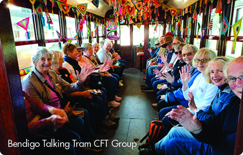 Seniors waving inside Bendigo talking tram