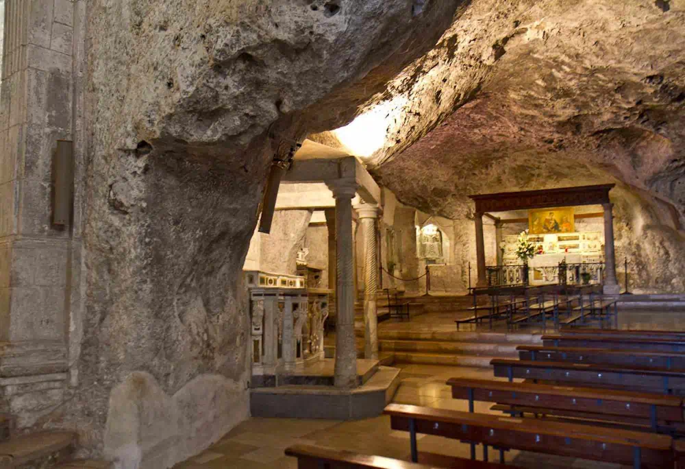 Interior of historic cave church with altar