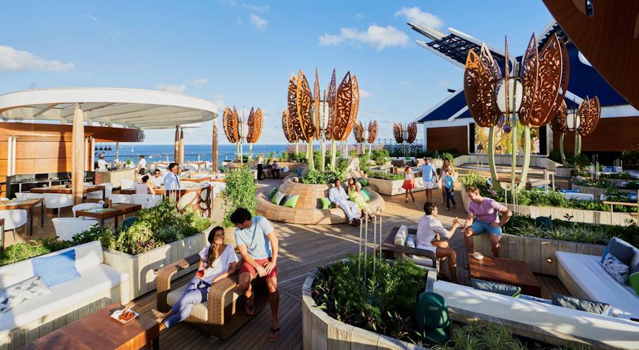 People relaxing on modern cruise ship rooftop deck