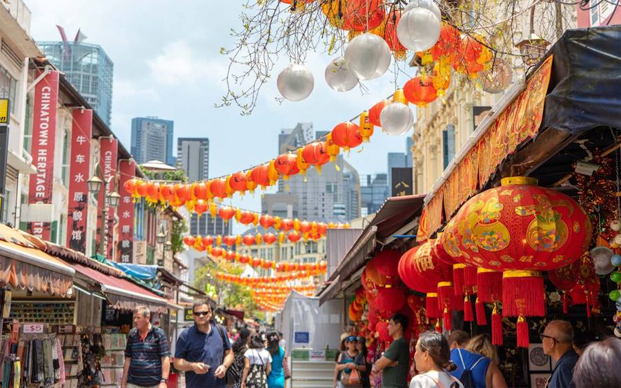 Chinatown street decorated with red lanterns overhead