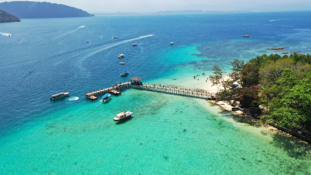 Aerial view of tropical island jetty and boats