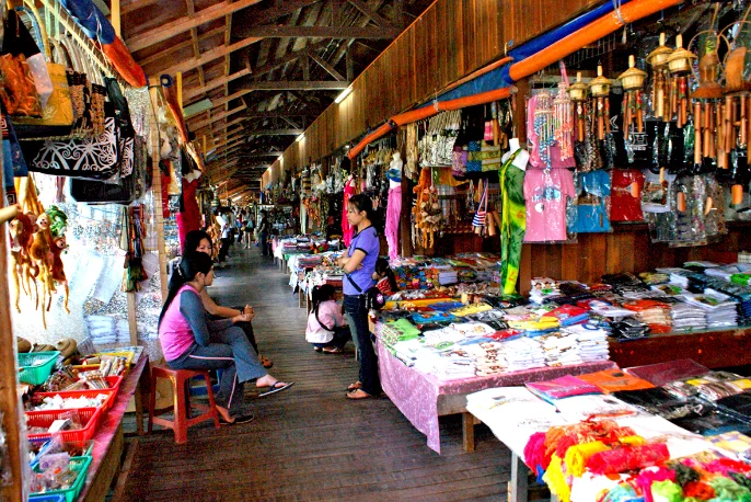 Indoor market with souvenir stalls and shoppers