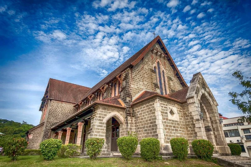 Historic stone church under blue sky