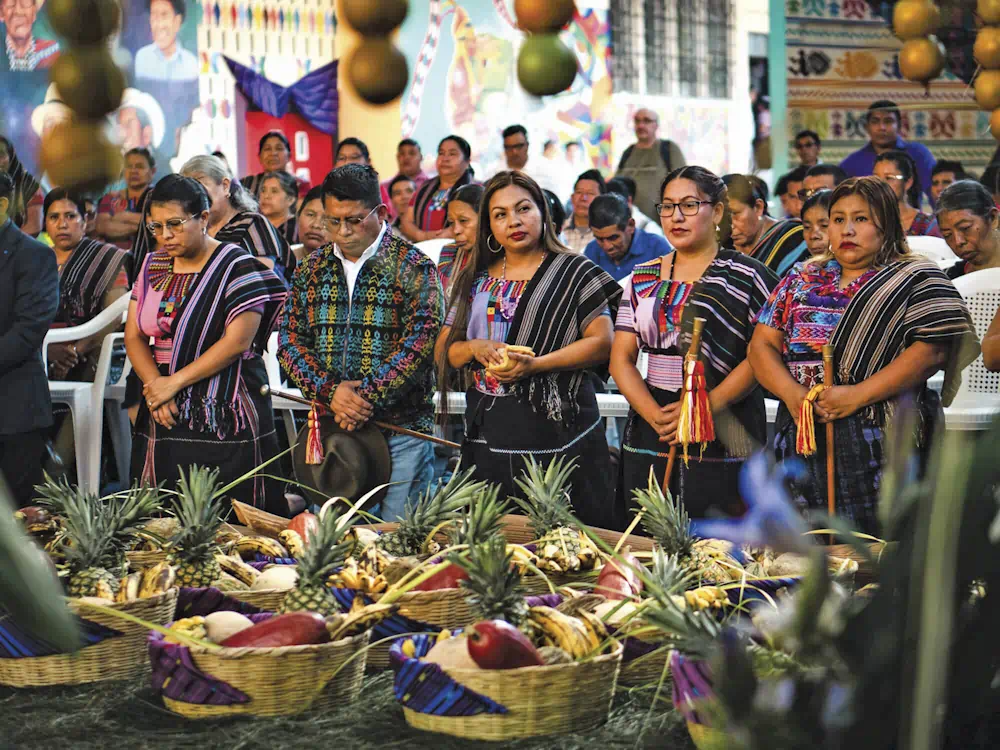 Community ceremony with traditional dress and fruit offerings