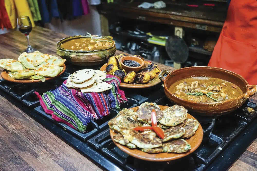 Traditional feast with stews, flatbreads and grilled bananas