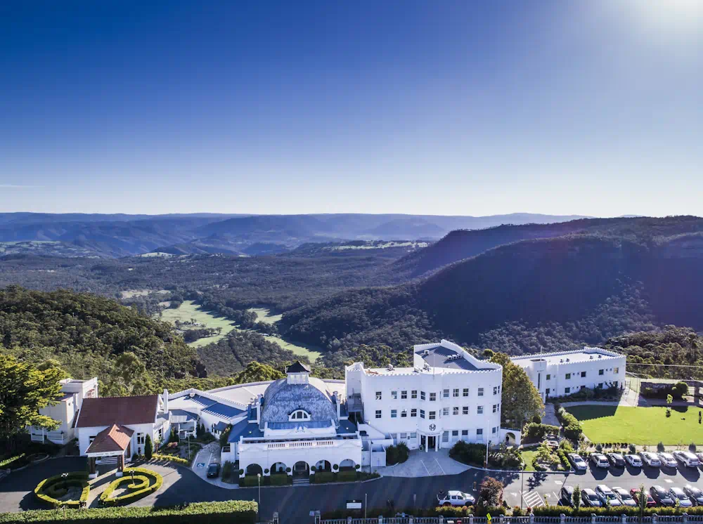 Hilltop resort overlooking lush mountain valley