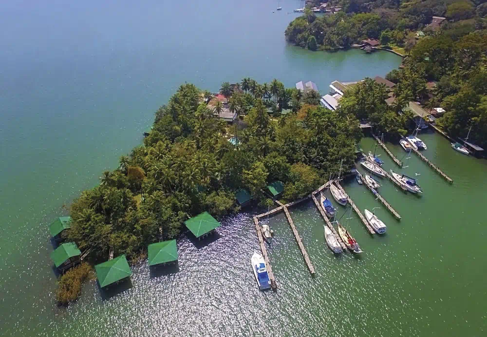 Aerial view of tropical island marina and huts