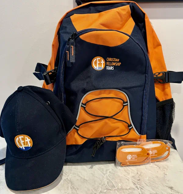 Navy and orange backpack with matching cap