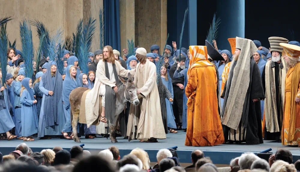 Jesus riding donkey in Palm Sunday reenactment