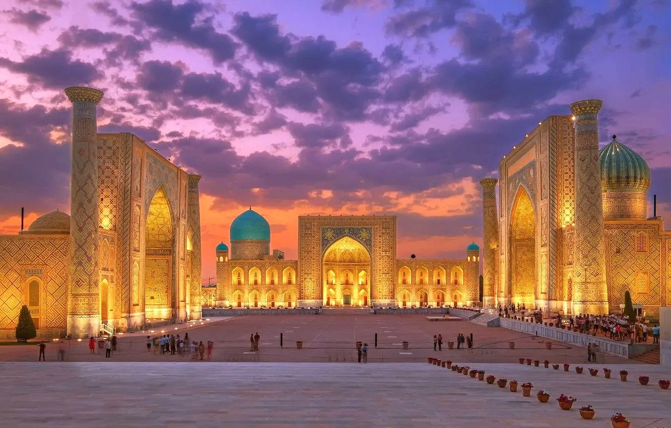Registan Square illuminated at sunset in Samarkand, Uzbekistan