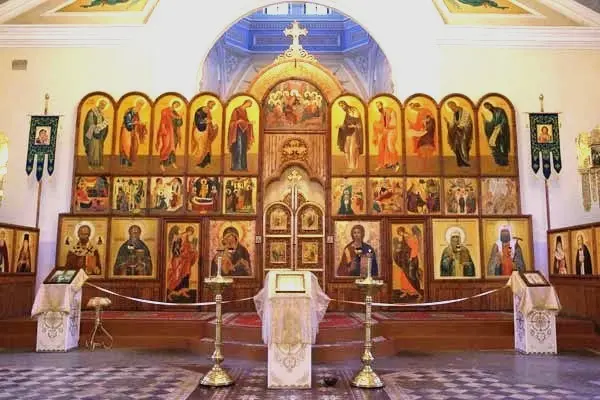 Ornate Orthodox church iconostasis with golden religious icons