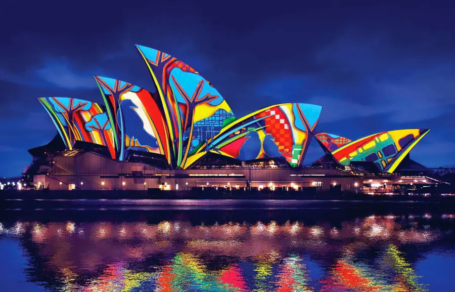 Sydney Opera House illuminated with colourful projection art at night